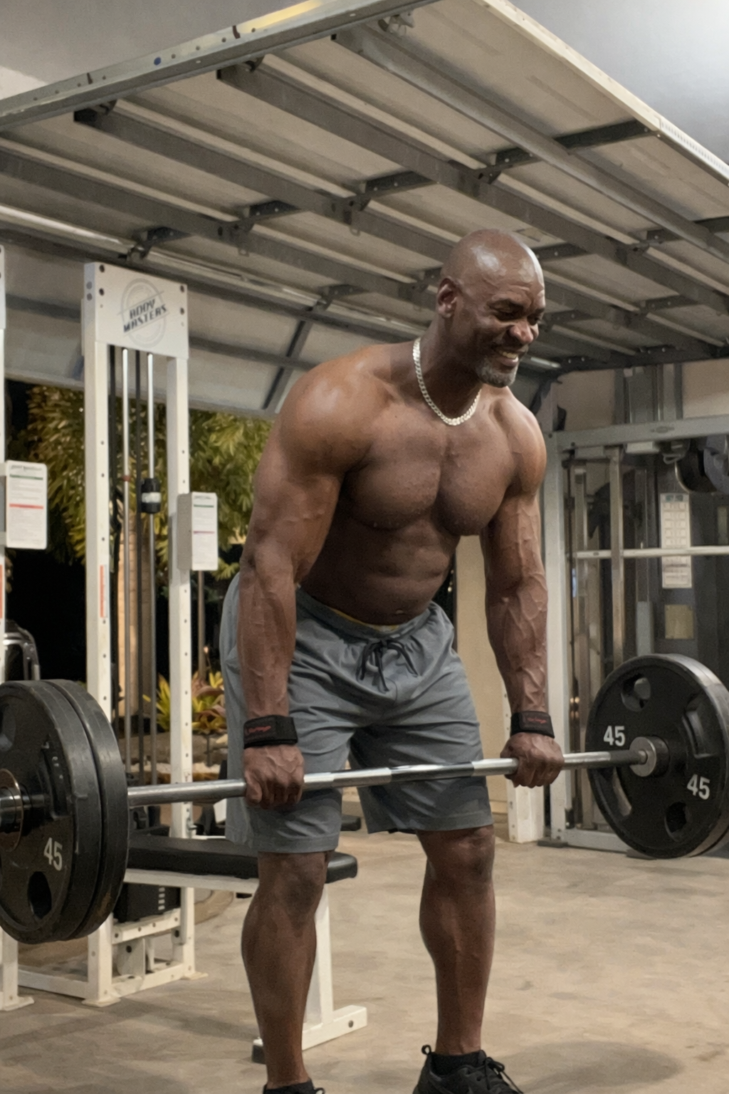 Muscular man practicing deadlift at home gym